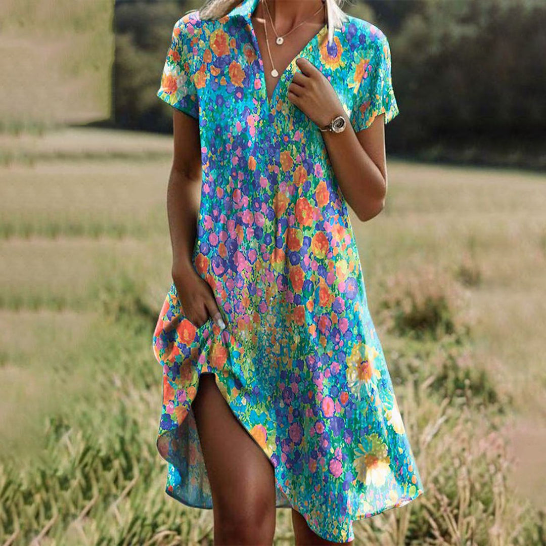 Ademende Daniella midi zomerjurk voor dames met bloemenprint en korte mouwen, ideaal voor strand en casual dagen.