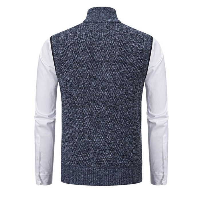 Mouwloos gebreid herenvest in blauw, grijs, rood en zwart, met rits, minimalistisch design, veelzijdig te dragen.