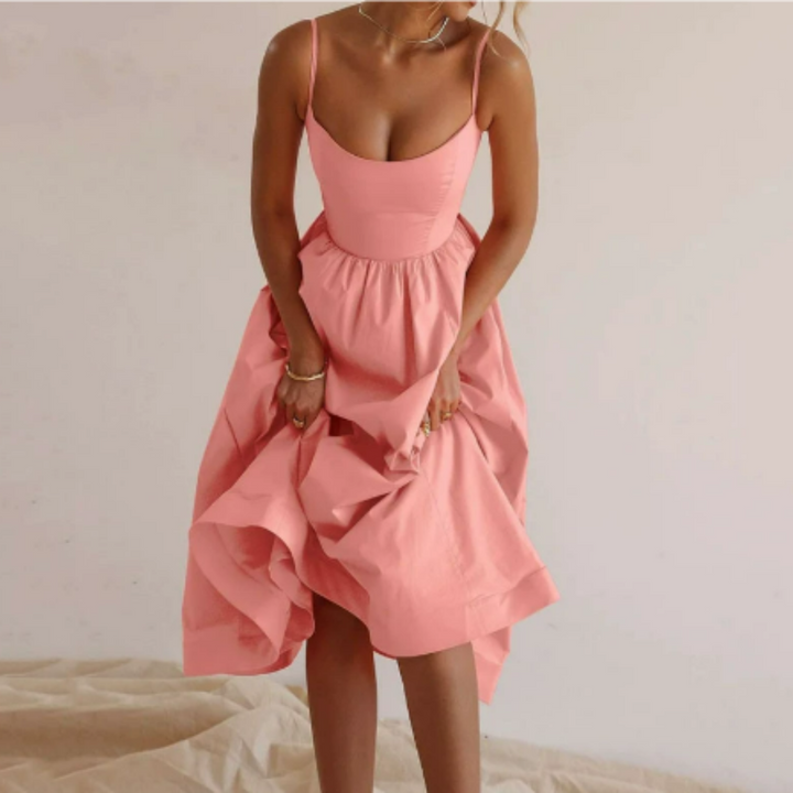 Zomerjurk dames met A-lijn pasvorm, midi-lengte, mouwloos, ideaal voor casual of feestelijke zomerse momenten.