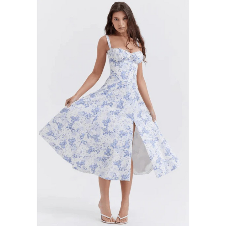 Mouwloze zomerjurk met sweetheart halslijn, elegante midi-snit en getailleerd design voor een vrouwelijk silhouet.