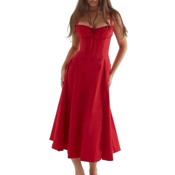 Mouwloze zomerjurk met sweetheart halslijn, elegante midi-snit en getailleerd design voor een vrouwelijk silhouet.