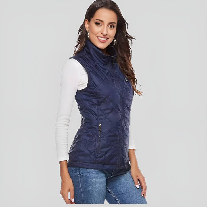 Verwarmd damesvest met 9 verwarmingszones, flexibel ontwerp, optimaal draagcomfort, werkt op batterijen, ideaal voor koude dagen.