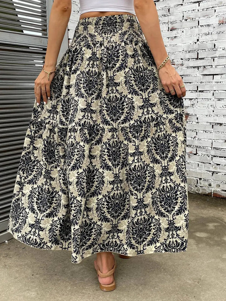 Boho Maxi-rok voor dames, vloeiend met patroon en verfijnde taille, voor elegante looks in Zwart, Rood of Bruin.