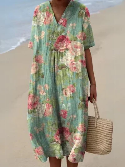Kleurrijke zomerjurk met bloemenprint, lichte elegantie, knielengte, luchtige stof, ideaal voor warme dagen en zomerse evenementen.