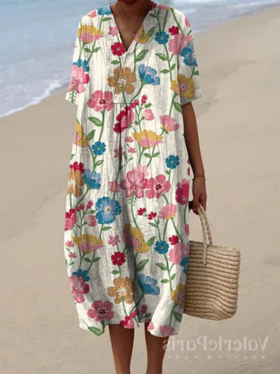 Kleurrijke zomerjurk met bloemenprint, lichte elegantie, knielengte, luchtige stof, ideaal voor warme dagen en zomerse evenementen.