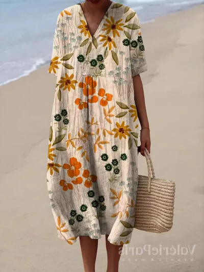 Kleurrijke zomerjurk met bloemenprint, lichte elegantie, knielengte, luchtige stof, ideaal voor warme dagen en zomerse evenementen.