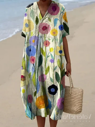 Kleurrijke zomerjurk met bloemenprint, lichte elegantie, knielengte, luchtige stof, ideaal voor warme dagen en zomerse evenementen.