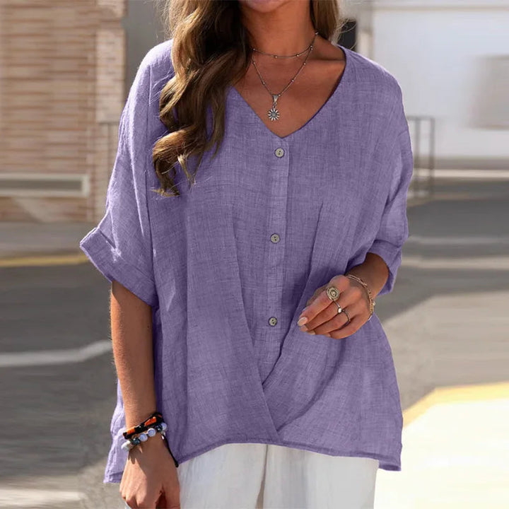 Luchtige damesblouse met knoopjes, V-hals en 3/4 mouw, een elegante en casual top voor alle vrouwen.