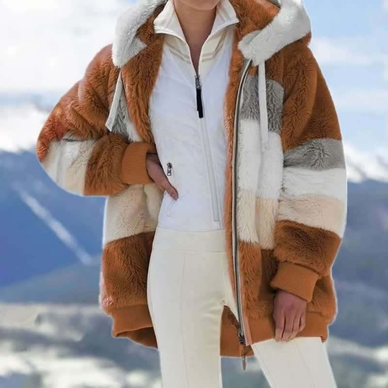 Close-up van de zachte, warme stof van de ComfyCoat™ dames winterjas. Heerlijk comfortabel.