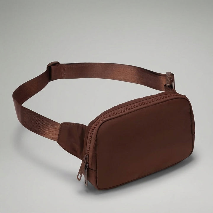 Veelzijdige Pocklet heuptas, waterafstotende nylon constructie, compact en unisex voor al je basics.