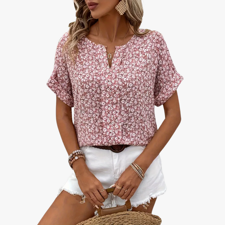 Damesblouse met bloemenprint, vintage stijl, elegante pasvorm, zachte stof, perfect voor op kantoor of speciale gelegenheden.