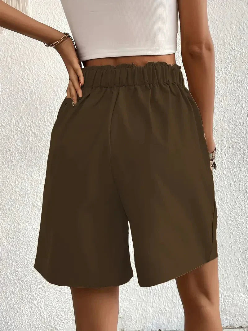 Dames high waist shorts van linnen met schuine zakken, zijaanzicht van model