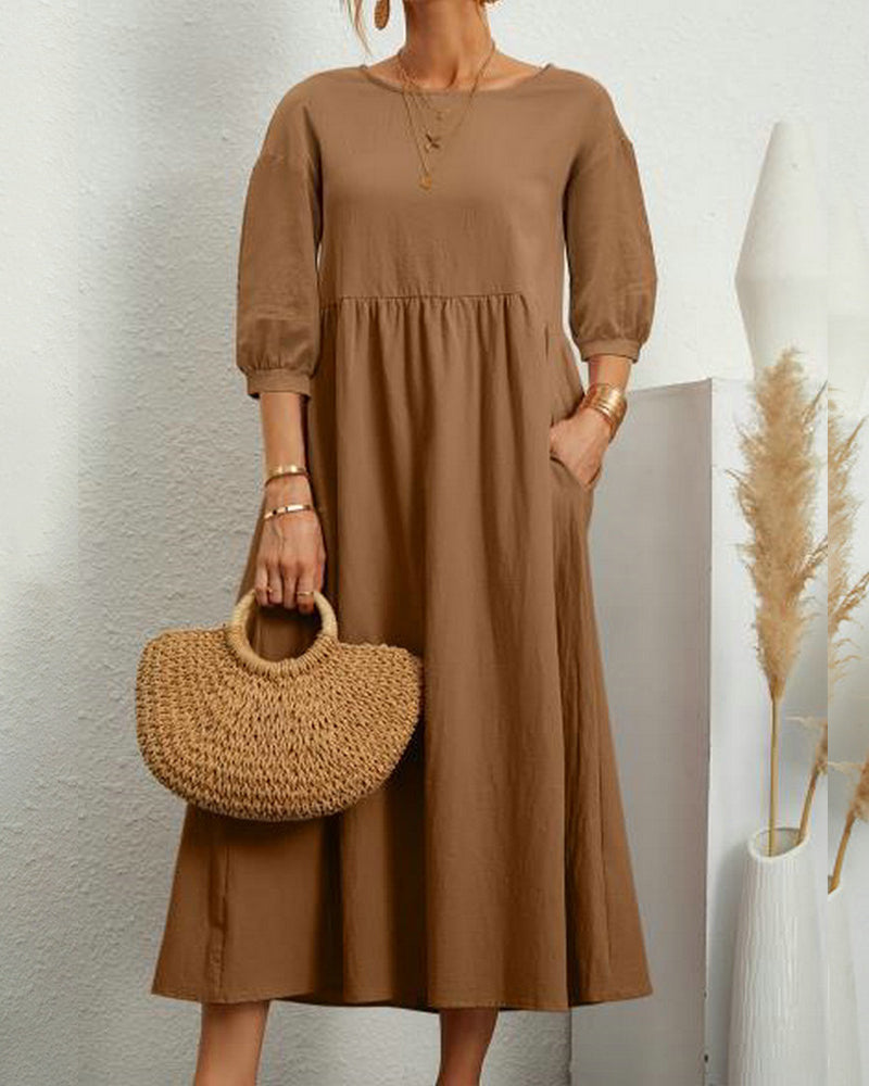 Dames midi jurk met 3/4 mouwen en ronde hals in zwart