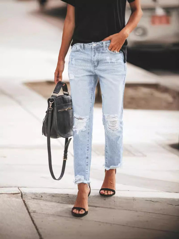 Dames Ripped Denim Jeans, casual pasvorm, gerafelde zoom, urban blauwe jeans, trendy details, veelzijdig te dragen.
