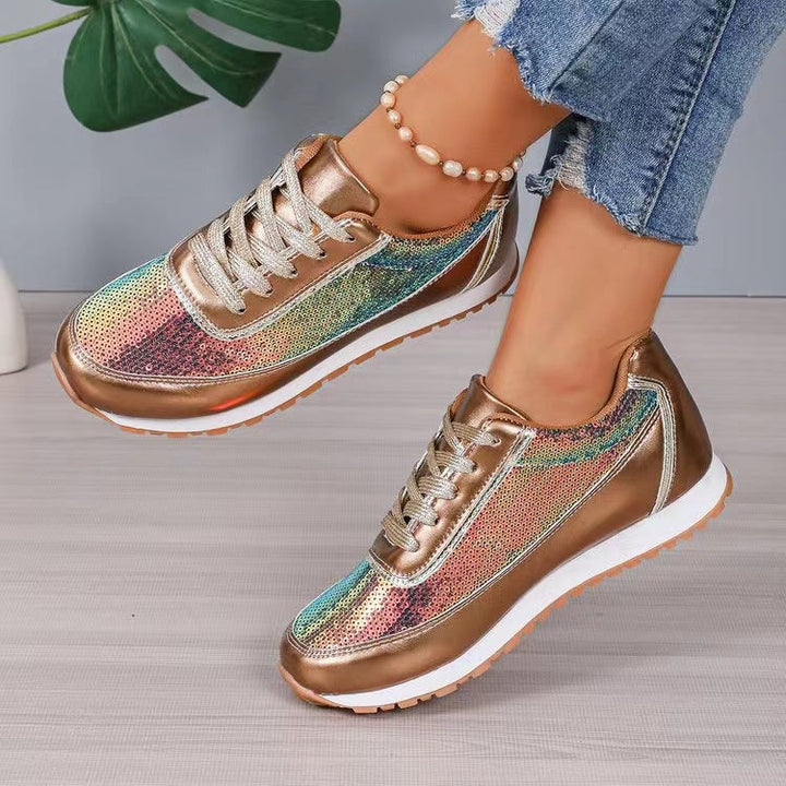 Dames sneaker in champagnekleurige glans