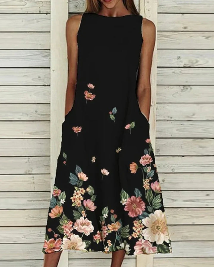 Dames zomerjurk met bloemenprint, A-lijn, midi-lengte, levendige bloemen, ideaal voor zomerse gelegenheden, vrouwelijke pasvorm.