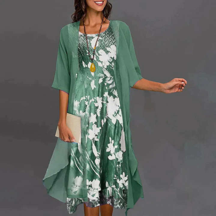 Damesjurk met bloemenprint, mini, aangevuld met elegante blazer, ideaal voor stijlvolle gelegenheden en vrouwelijke elegantie.