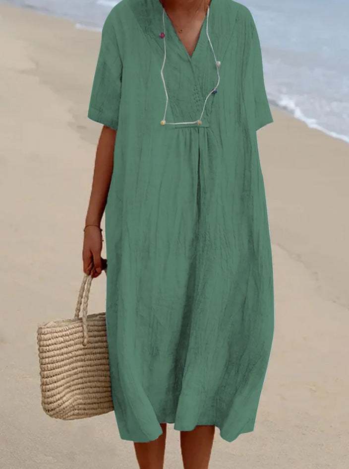 Casual V-hals midi jurk voor dames. Veelzijdige A-lijn jurk met korte mouwen, ideaal als strandjurk of lente outfit.