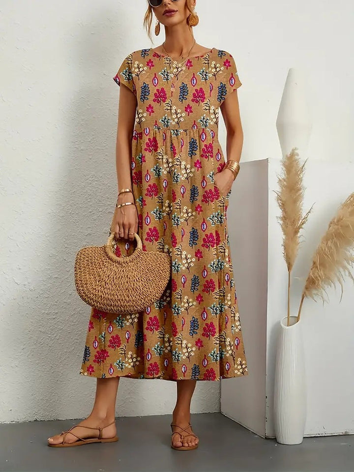 Veelzijdige dames bloemen midi jurk met A-lijn, zomerse uitstraling en zakken voor een elegante look.
