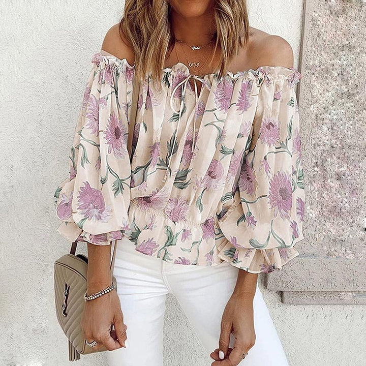 Dames bloemen blouse met ruches mouwen. Elegante, losvallende chiffon top, perfect voor lente/zomer.