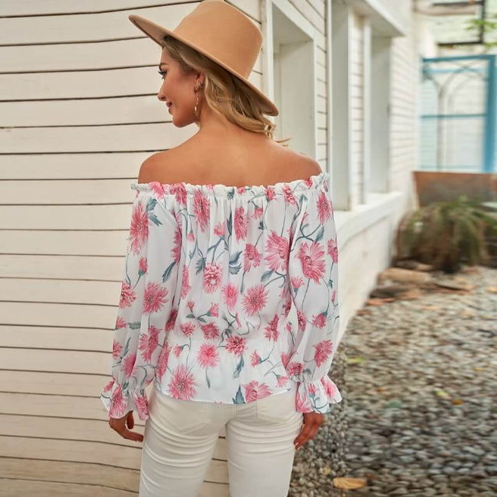 Veelzijdige dames zomerblouse: gebloemde top met ruches mouwen. Makkelijk te combineren voor casual of chique.