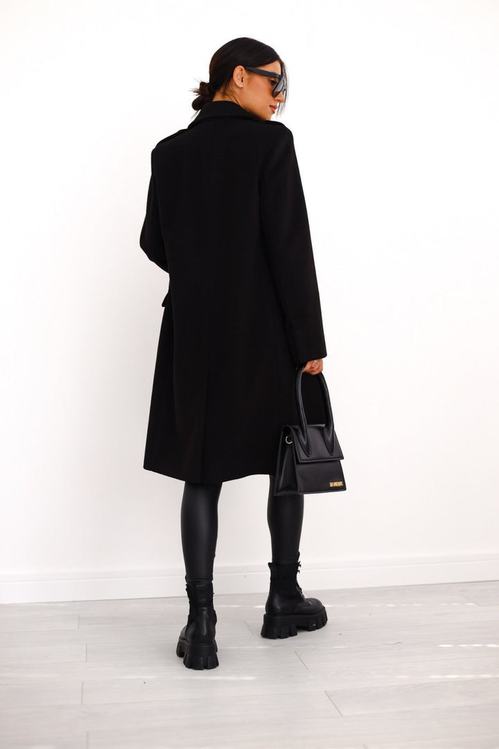 Stijlvolle lange double-breasted winterjas voor dames. Elegante en warme bovenkleding.
