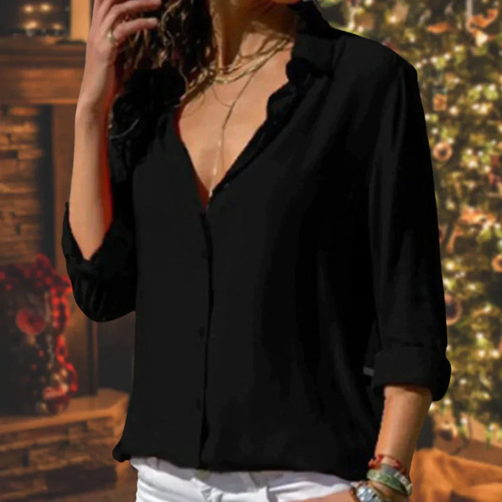 Elegante damesblouse met lange mouw en getailleerde snit, een veelzijdige keuze voor damesmode.