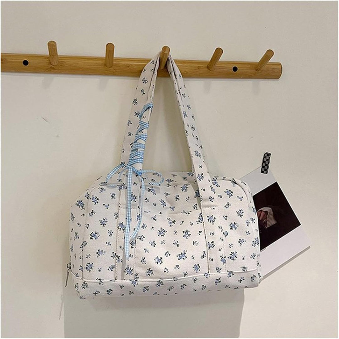 Veelzijdige dames canvas weekendtas, roze, met lintenaccent, als schoudertas comfortabel te dragen.