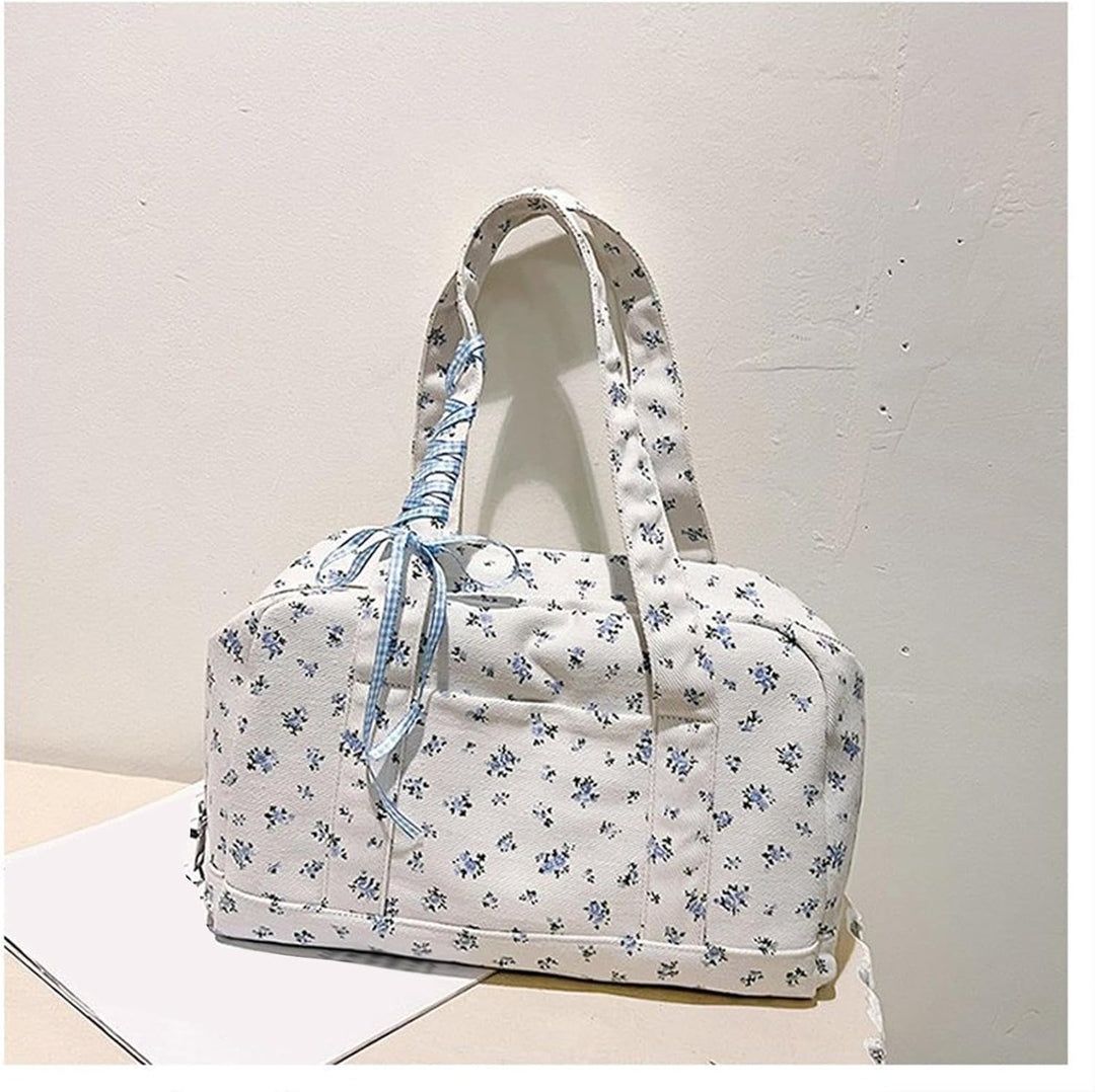 Dames Floria grote canvas weekendtas, roze, met lintenaccent en lange schouderband, op reis.