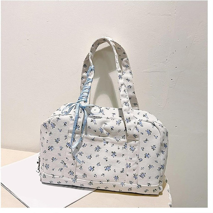 Dames Floria grote canvas weekendtas, roze, met lintenaccent en lange schouderband, op reis.