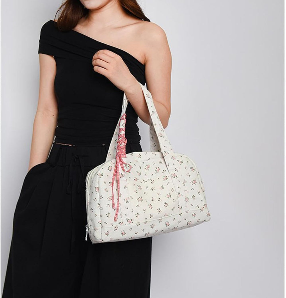 Roze Floria canvas weekendtas voor dames, met elegante strik en ruime opbergruimte. Perfect voor reizen.