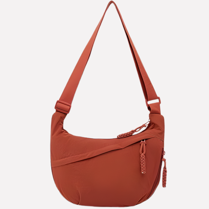 Halvemaan crossbody tas voor dames. Ruim, praktisch en van stevig nylon met verstelbare band.