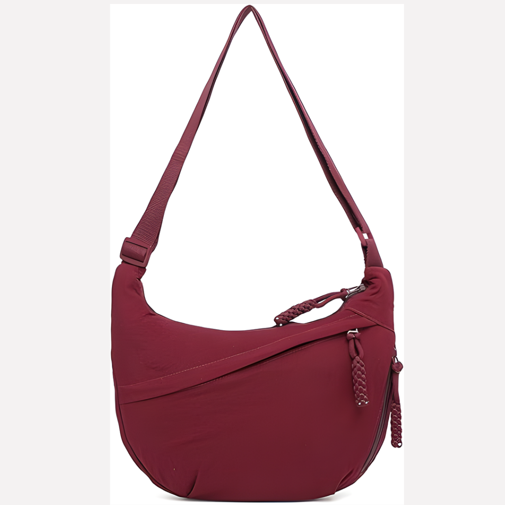 Perfecte dagelijkse tas: halvemaan crossbody model. Lichtgewicht nylon en handenvrij te dragen.