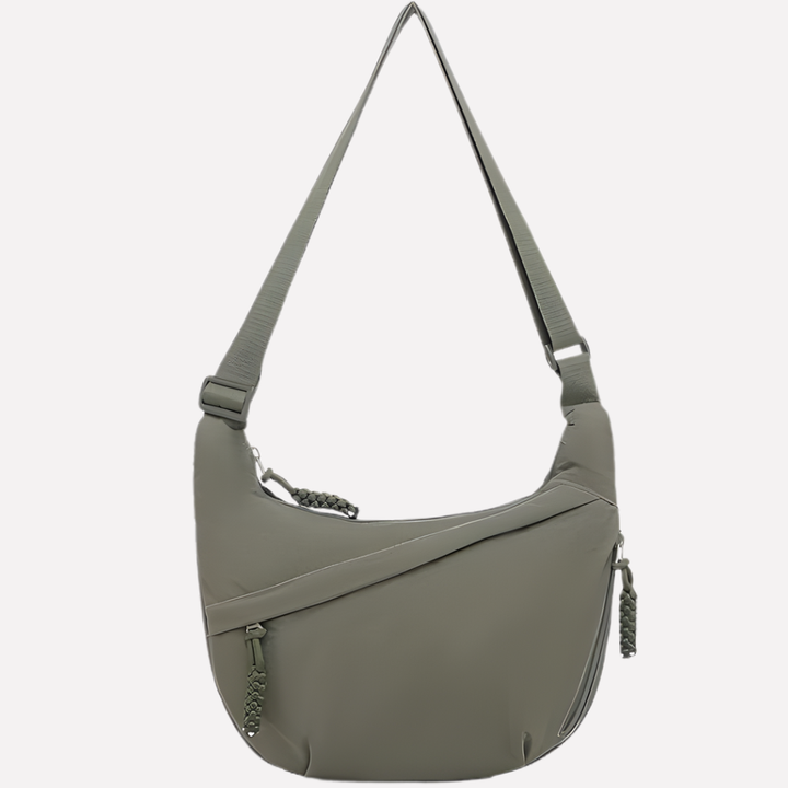 Casual halvemaan tas voor dames, ideaal als dagelijkse tas. Ruim en organiseerbaar interieur.