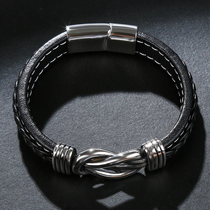 Robuuste zwarte lederen knoop armband voor dames, met een tijdloze infinity symbool, ideaal als stijlvol accessoire.