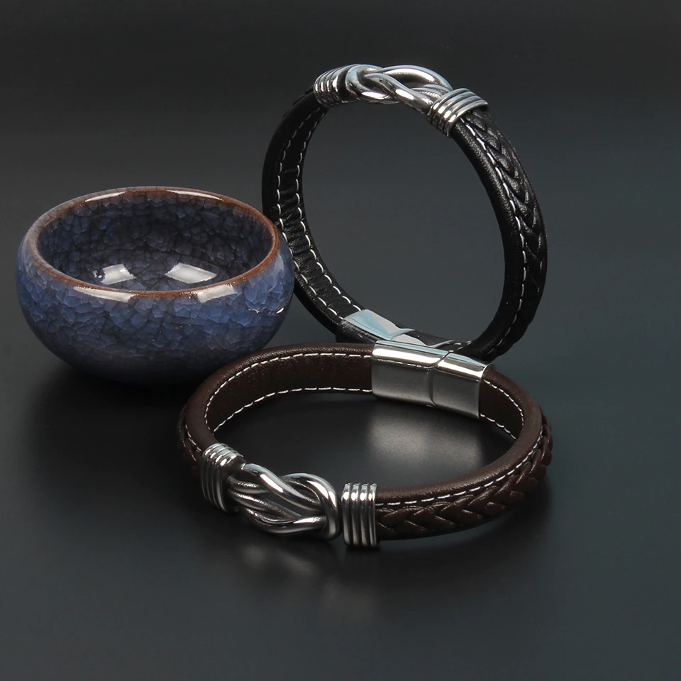Elegante damesarmband met lederen knoop en infinity symbool, verkrijgbaar in zwart & bruin, geschikt voor elke stijl.