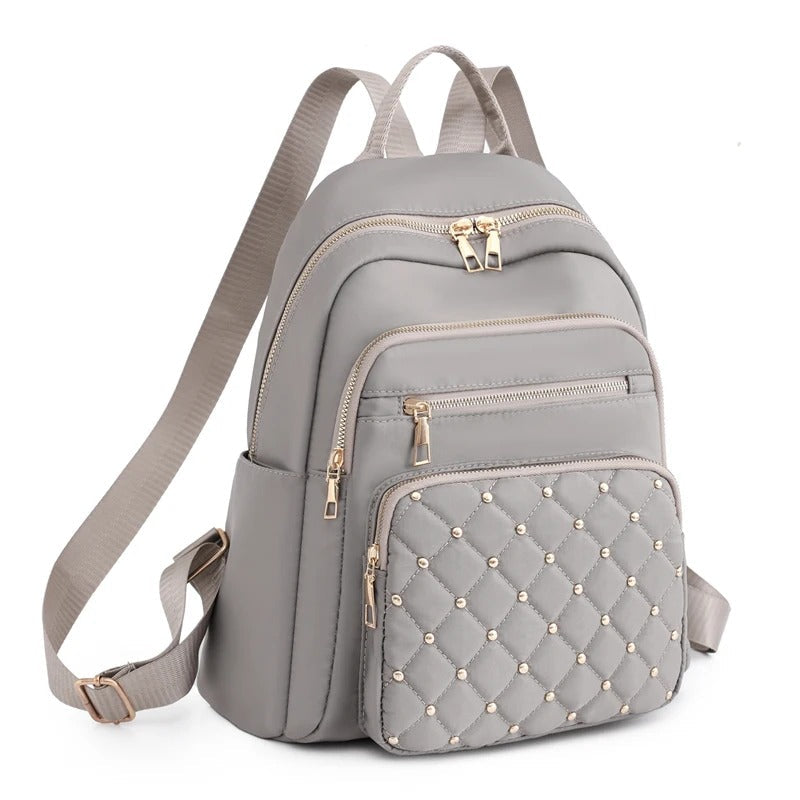 Khaki lichtgewicht waterafstotende nylon damesrugzak, perfect als schooltas of reistas.