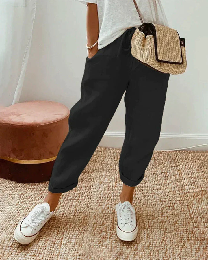 Witte linnen broek Meav voor dames, losse pasvorm en comfortabel, ideaal voor luchtige en stijlvolle zomeroutfits.
