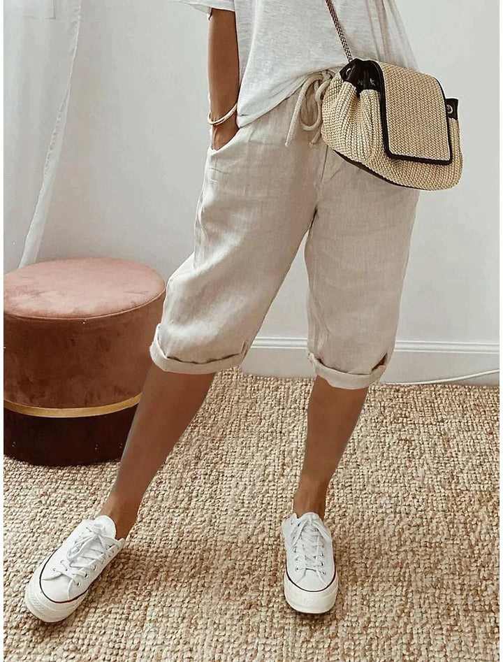 Dames linnen broek met wijde pijpen, comfortabel en ademend, ideaal voor zomer en strand.