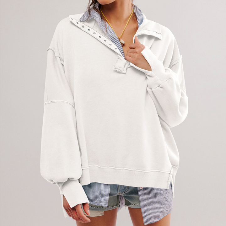 Gedetailleerde close-up van dames Henley pullover halslijn met knoopjes; zachte oversized trui met losse pasvorm.