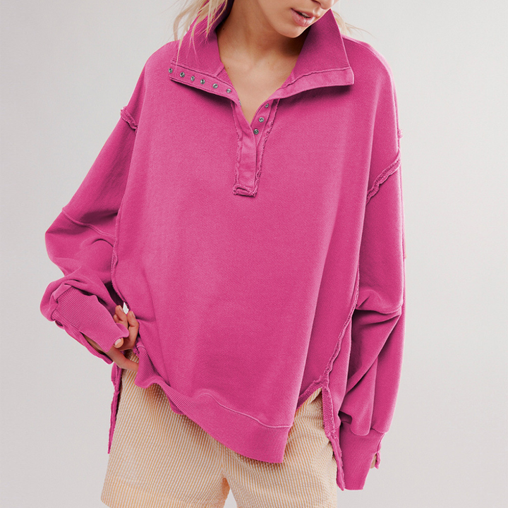 Zijaanzicht van dames oversized Henley pullover met trendy hoog-laag zoom en lange mouwen; casual en comfortabel.