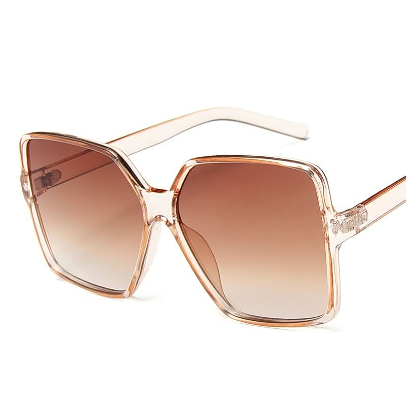 Dameszonnebril met grote, gekleurde glazen; biedt UV-bescherming en stijl.