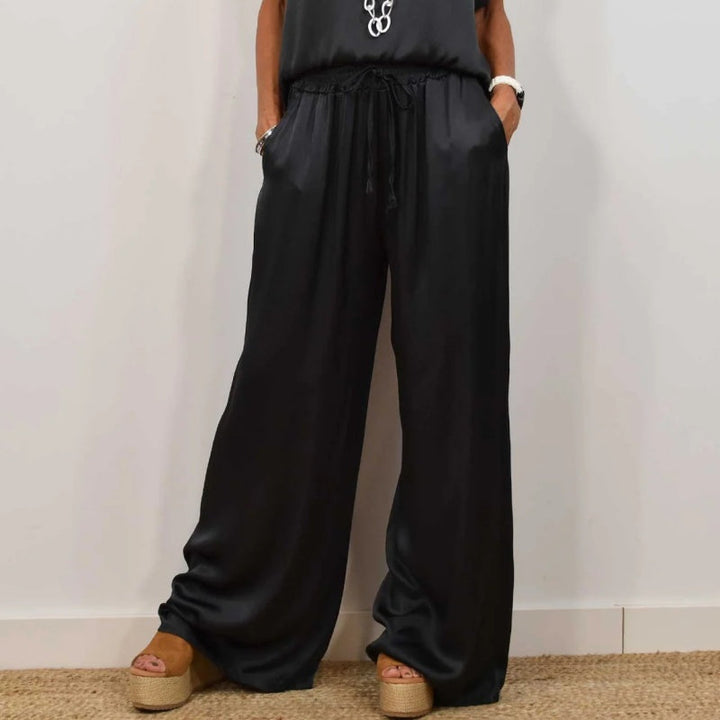 Trendy dames tweedelige set met palazzo broek en relaxte pasvorm. Ultiem comfort voor zomerse dagen.
