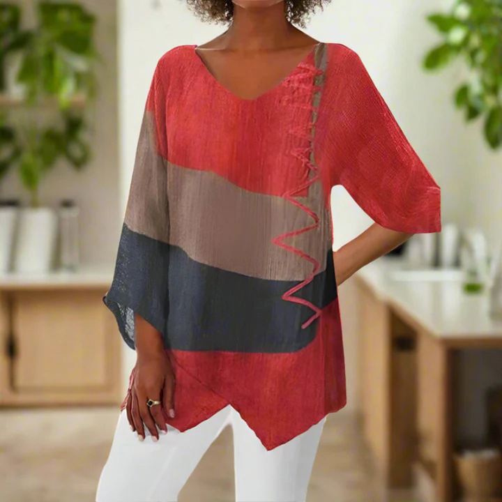 Driekleurige damesblouse met lange mouwen in blauw, geel, rood, vorenaanzicht, elegant design, ideaal voor een zomerse look.