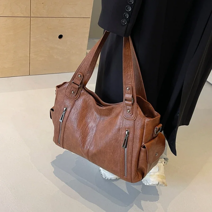 Elegante dames schoudertas van hoogwaardig leer met verstelbare riem en een stijlvol, tijdloos ontwerp.