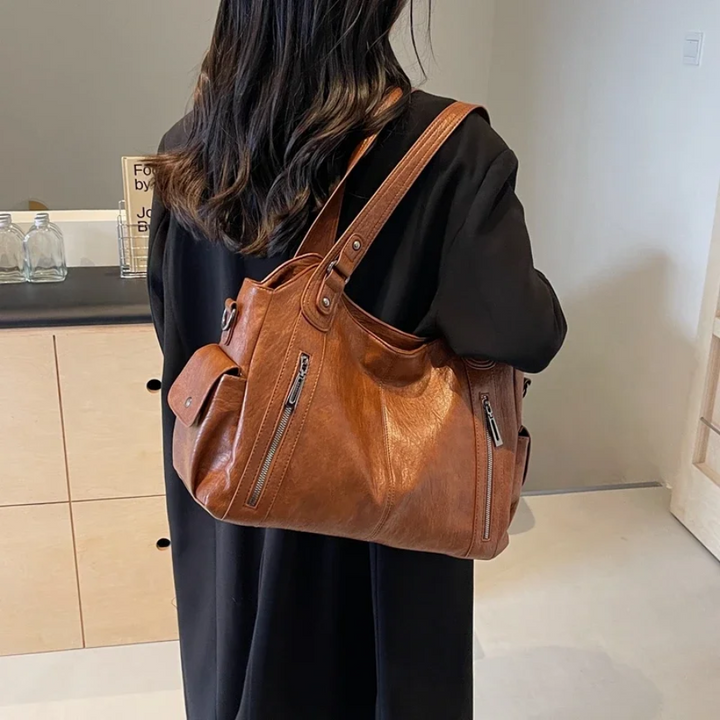Elegante dames schoudertas van hoogwaardig leer met verstelbare riem en een stijlvol, tijdloos ontwerp.