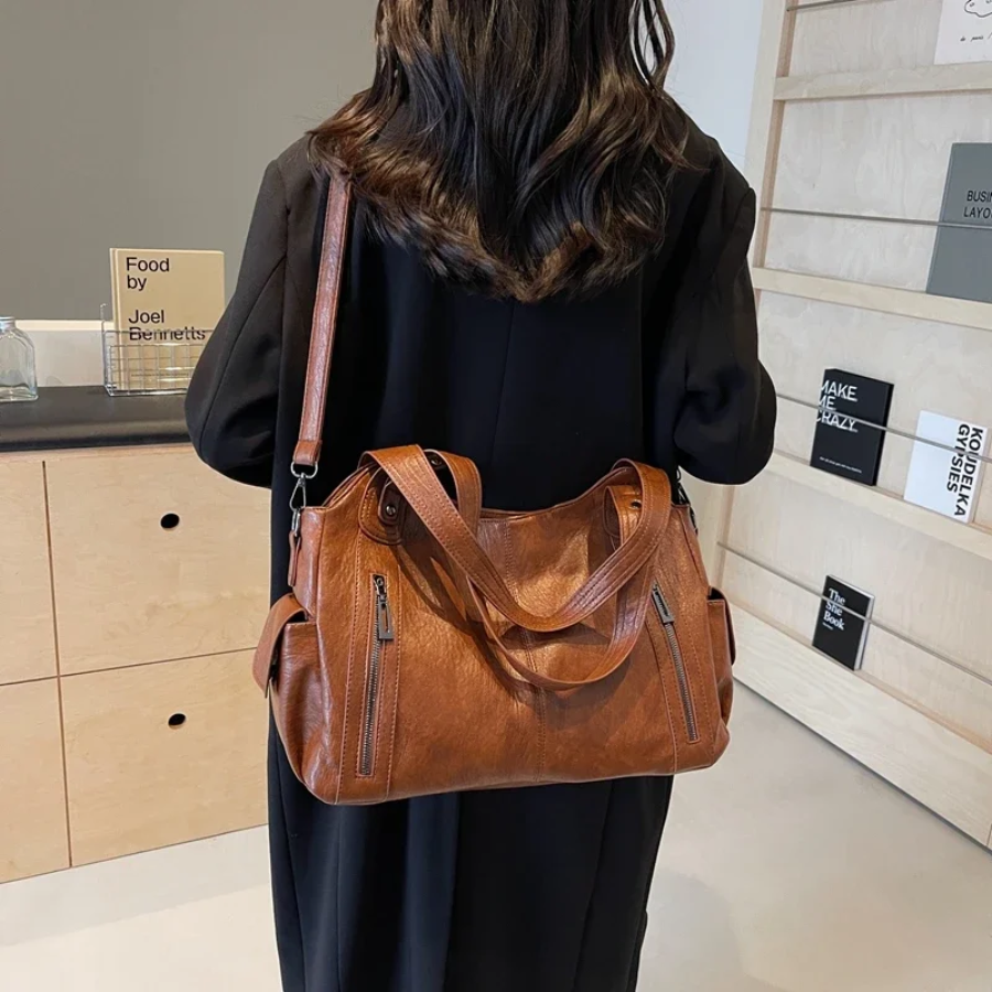 Elegante dames schoudertas van hoogwaardig leer met verstelbare riem en een stijlvol, tijdloos ontwerp.