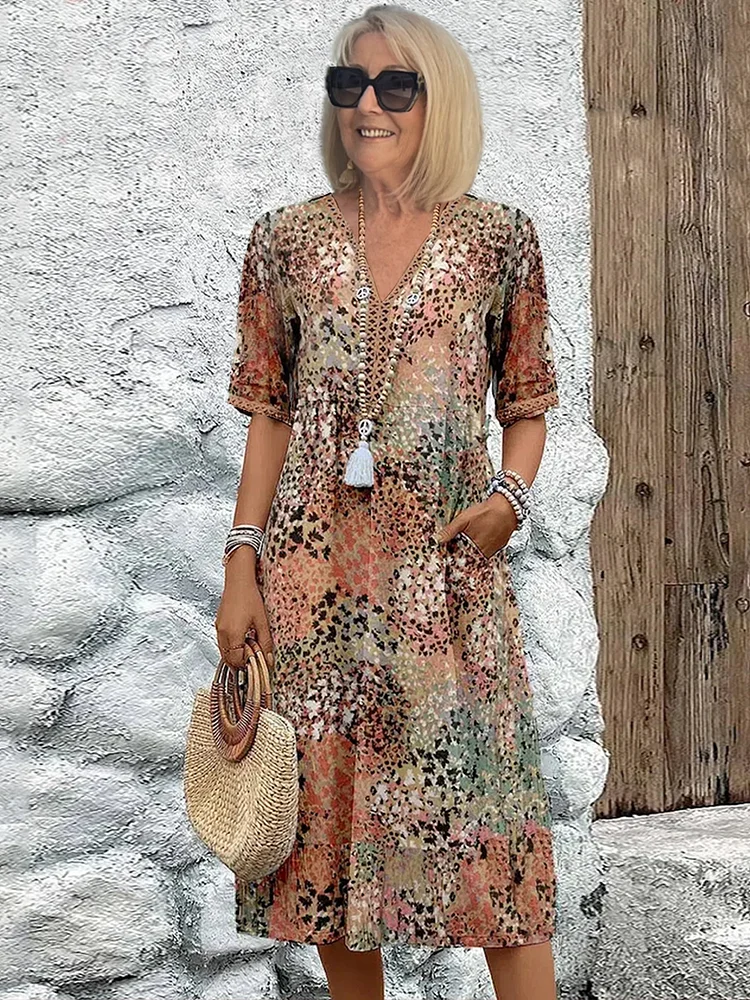 Elegante dames A-lijn midi jurk met V-hals en levendige bloemenprint, perfect voor lente/zomer.