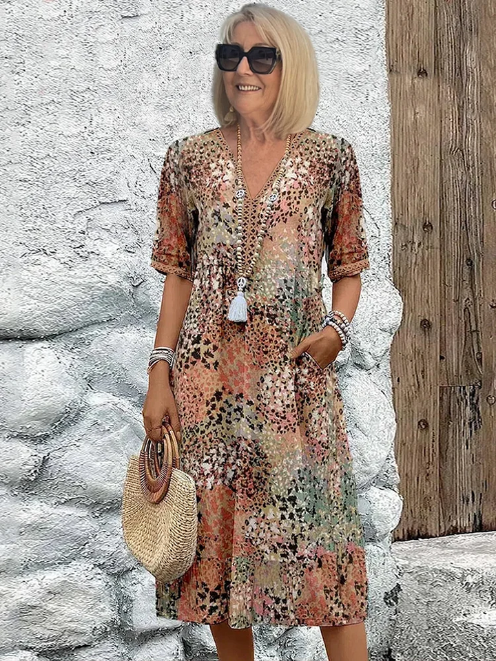 Elegante dames A-lijn midi jurk met V-hals en levendige bloemenprint, perfect voor lente/zomer.