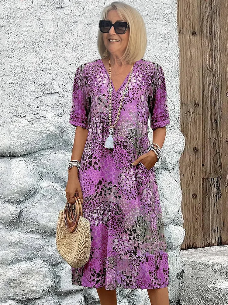 Luchtige dames lente/zomerjurk: A-lijn midi met V-hals en vrolijke bloemenprint. Casual of chic.